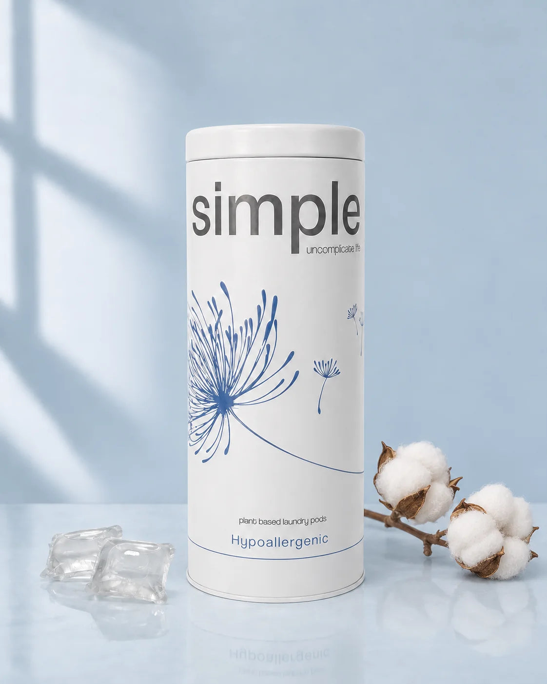 The simple Hypoallergenic tin with two clear pods and a sprig of cotton bolls