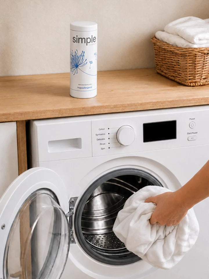 Laundry going into the same machine, with the display still off
