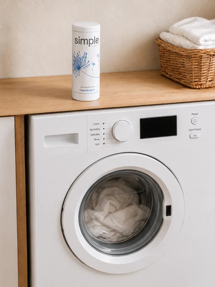 The machine with its door closed and laundry inside, ready to switch on